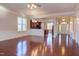Open living room with hardwood floors and views to kitchen and entry at 7845 Hasentree Lake Dr, Wake Forest, NC 27587