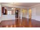 Hardwood floor living room, views to kitchen and entryway at 7845 Hasentree Lake Dr, Wake Forest, NC 27587