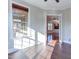 Sunlit office with hardwood floors and French doors at 7845 Hasentree Lake Dr, Wake Forest, NC 27587