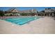 A long swimming pool with lane markers surrounded by lounge chairs and umbrellas in a luxurious community at 7845 Hasentree Lake Dr, Wake Forest, NC 27587