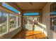 Bright sunroom with hardwood floors and ample natural light at 7845 Hasentree Lake Dr, Wake Forest, NC 27587