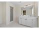 Bathroom with double vanity, large mirror, and shower at 8179 Highway 39, Middlesex, NC 27557