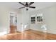 Hardwood floors and a ceiling fan in a bright bedroom at 8179 Highway 39, Middlesex, NC 27557