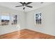 Well-lit bedroom with hardwood floors and large windows at 8179 Highway 39, Middlesex, NC 27557