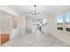 Modern kitchen with white cabinets and marble-look flooring at 8179 Highway 39, Middlesex, NC 27557