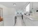 Bright kitchen featuring white cabinets, stainless steel appliances, and a large island at 8179 Highway 39, Middlesex, NC 27557