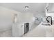 Renovated kitchen boasts white cabinets, stainless steel appliances, and a large island at 8179 Highway 39, Middlesex, NC 27557