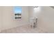 Bright laundry room with a utility sink and tile floor at 8179 Highway 39, Middlesex, NC 27557