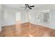 Open living room with hardwood floors and multiple doors at 8179 Highway 39, Middlesex, NC 27557