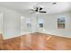 Bright living room featuring hardwood floors and a ceiling fan at 8179 Highway 39, Middlesex, NC 27557