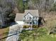 Charming two-story home with gray siding, attached two-car garage, and well-manicured landscaping at 1002 Santa Rosa Dr, Apex, NC 27502