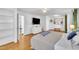 Bright bedroom with hardwood floors, built-in shelving, and ensuite bath at 101 Pebble Springs Rd, Chapel Hill, NC 27514