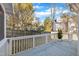 Spacious deck overlooking backyard with trees and neighboring homes at 101 Pebble Springs Rd, Chapel Hill, NC 27514