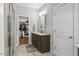 Bathroom with granite vanity, large mirror, and walk-in shower at 1134 Bowling Mountain Dr, Stem, NC 27581