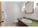Simple bathroom with a single vanity, mirror, and toilet at 11509 Hardwick Ct, Raleigh, NC 27614