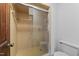 Tiled bathroom with walk-in shower and sliding glass doors at 11509 Hardwick Ct, Raleigh, NC 27614