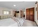 Spacious bedroom featuring soft carpet, neutral walls, a dresser and an ensuite bathroom at 11509 Hardwick Ct, Raleigh, NC 27614