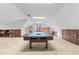 Bonus room with pool table, hanging chair, and built-in cabinets at 11509 Hardwick Ct, Raleigh, NC 27614