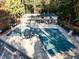 Aerial view of a covered community pool with a building, showcasing recreation and leisure at 11509 Hardwick Ct, Raleigh, NC 27614