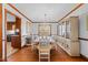 Elegant dining room featuring hardwood floors and a large window offering natural light at 11509 Hardwick Ct, Raleigh, NC 27614