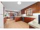 Traditional style kitchen featuring wood cabinets, a large window, and an open layout at 11509 Hardwick Ct, Raleigh, NC 27614