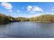 Scenic lake view showcasing the surrounding trees and tranquil open water at 11509 Hardwick Ct, Raleigh, NC 27614