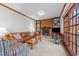 Welcoming living room with a brick fireplace, built-in shelves, and comfortable seating at 11509 Hardwick Ct, Raleigh, NC 27614