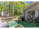 Outdoor wooden deck with grill and furniture with a view of the backyard and bonus shed at 1304 Rothes Rd, Cary, NC 27511