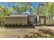 Home exterior with patio, grill and paver path to lawn and trees at 1304 Rothes Rd, Cary, NC 27511