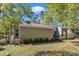House exterior with trees, patio and paver path to lawn and shed at 1304 Rothes Rd, Cary, NC 27511