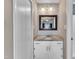 Bathroom vanity with granite countertop, framed mirror and soft, neutral paint at 1304 Rothes Rd, Cary, NC 27511