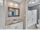 Cozy bathroom featuring a granite countertop vanity and a shower-tub combination at 1304 Rothes Rd, Cary, NC 27511