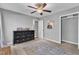 Bedroom with a ceiling fan, neutral walls, and a black dresser at 1304 Rothes Rd, Cary, NC 27511
