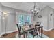 Inviting dining area with modern light fixture and access to the outdoors at 1304 Rothes Rd, Cary, NC 27511