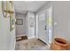 Bright foyer with tile floors, a mirror, and natural light at 1304 Rothes Rd, Cary, NC 27511