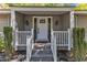 Inviting front porch with stylish accents and a welcoming entrance at 1304 Rothes Rd, Cary, NC 27511