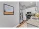 Galley kitchen features stainless steel appliances, granite countertops and white cabinetry at 1304 Rothes Rd, Cary, NC 27511