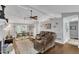 Spacious living room with a vaulted ceiling, a ceiling fan, and a dining area at 1304 Rothes Rd, Cary, NC 27511