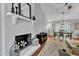 Spacious living room features a whitewashed fireplace and an open floor plan at 1304 Rothes Rd, Cary, NC 27511