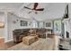 Spacious living room with a vaulted ceiling, a ceiling fan, and hardwood floors at 1304 Rothes Rd, Cary, NC 27511