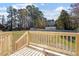 Deck overlooking a fenced backyard with storage shed at 141 Eason Dr, Smithfield, NC 27577