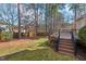 Private backyard with deck and stairs leading down at 1501 Carrickfergus Ct, Durham, NC 27713