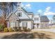 Two-story house with stone and siding, 3-car garage, and manicured lawn at 1620 Dail Dr, Raleigh, NC 27603