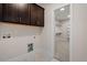 Laundry room with built-in cabinets and access to a large closet at 1620 Dail Dr, Raleigh, NC 27603