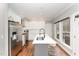 Modern kitchen with white cabinets and a large island at 2009 Longwood Dr, Raleigh, NC 27612