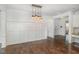 Spacious dining room featuring a modern light fixture and wood floors at 2025 Ginseng Ln, Raleigh, NC 27603