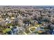 Aerial view showing a neighborhood with houses and tree-lined streets at 2035 Stuart Ct, Burlington, NC 27215