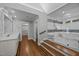 Bathroom featuring a vanity and a glass shower stall with luxurious finishes and wood flooring at 2035 Stuart Ct, Burlington, NC 27215