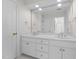 Double vanity bathroom with a large mirror and access to a shower at 2035 Stuart Ct, Burlington, NC 27215