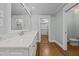 Well-lit bathroom featuring a double sink vanity with stone countertops and a walk-in closet at 2035 Stuart Ct, Burlington, NC 27215